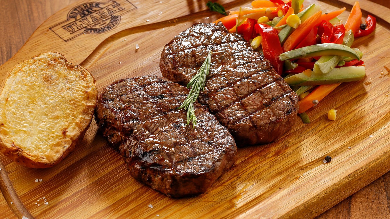 Premium steaks on cutting board
